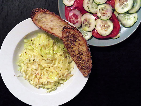 Creamed Cabbage Served with Mustard, Baguette and a Tomato and Cucumber Salad