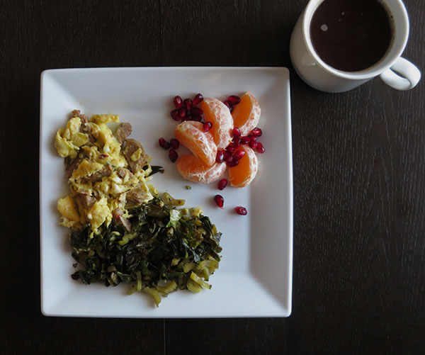 Scrambled Eggs with Andouille Sausage, Sautéed Greens, Satsuma Segments and Pomegranate Seeds