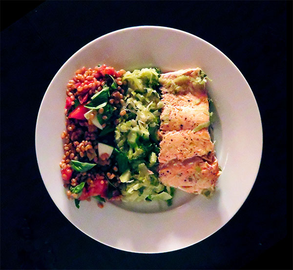 Coho Salmon Cooked on a Bed of Leeks and Broccoli and Served With Tomato, Cucumber and Basil Wheat Berry Salad