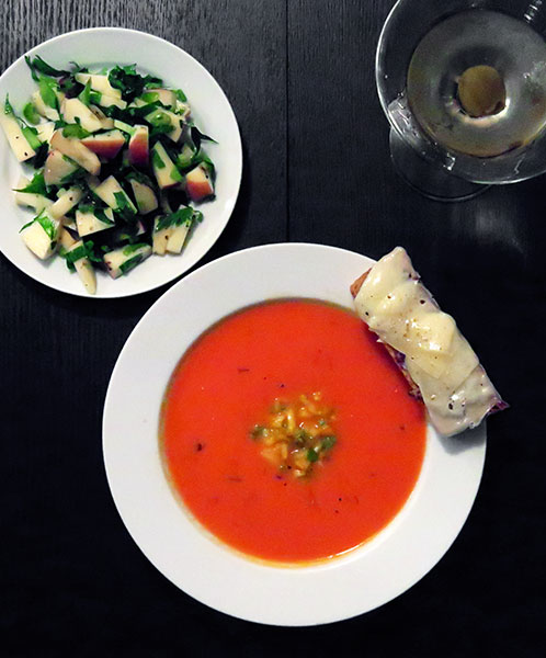 Fresh Tomato Soup Garnished With Mixed Sweet Peppers and Apple and Celery Salad