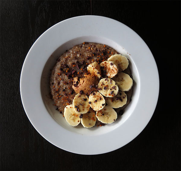Old World Hot Cereal With Bananas, Peanut Butter, Cocoa Nibs and Bee Pollen