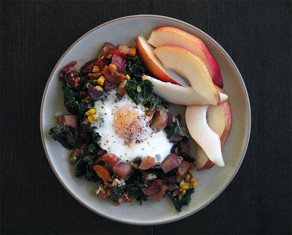 Fried Potato Hash With an Egg and Sliced Pears