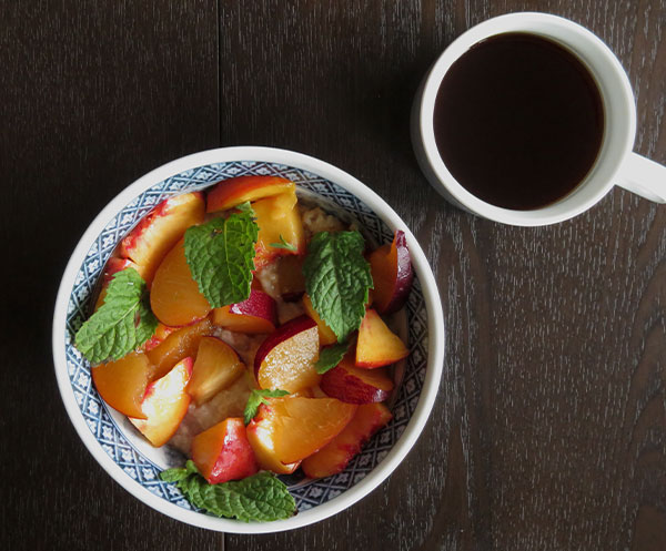 Scottish Oatmeal Topped With Nectarines and Fresh Mint