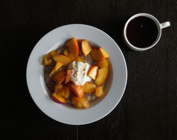 Scottish Oatmeal Topped With Nectarines, Plums, Yogurt and Cinnamon