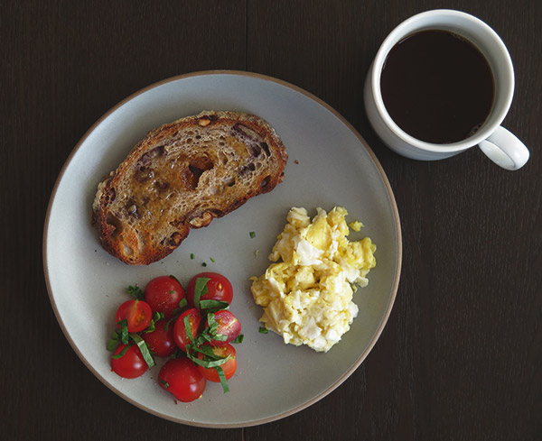 Fried-Scrambled Eggs Served with Toast and Cherry Tomato-Basil Salad