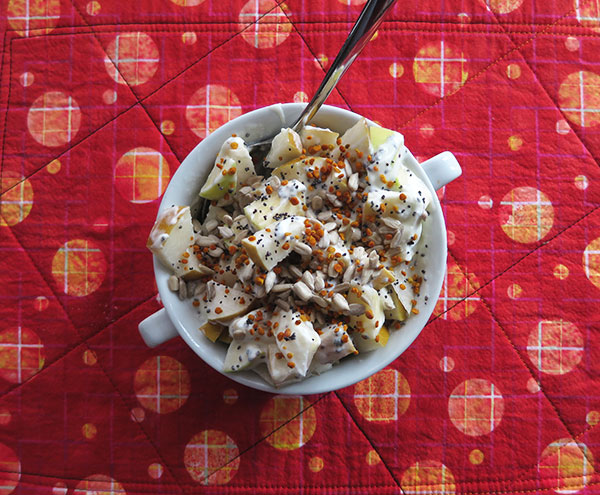 Apple and Asian Pear Yogurt Topped With Chia Seeds, Sunflower Seeds, Poppy Seeds and Bee Pollen