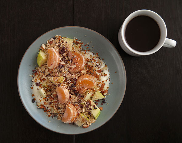 Yogurt Topped With Fresh Pears, Satsuma Segments, Rolled Oats, Almonds and Mixed Seeds