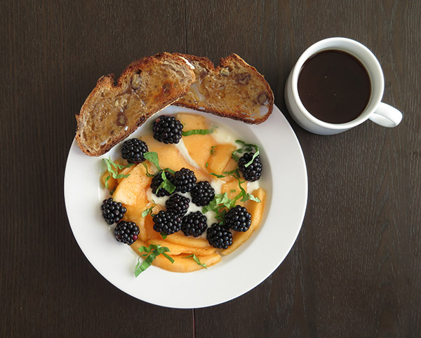 Plain Yogurt Topped with Fresh Cantaloupe, Blackberries & Basil, Served with Walnut Toast & Honey